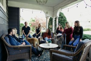 Blueprint Mental Health team discussing group therapy near me on a porch